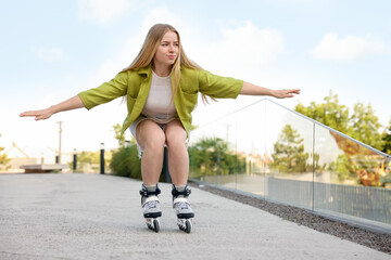 Happy woman roller skating on city street