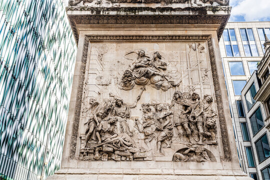 Close up of bas relief on the Monument to the Great Fire of London, Doric column in the historic City of London, UK