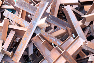 Rusty beams form a chaotic art piece in a scrapyard