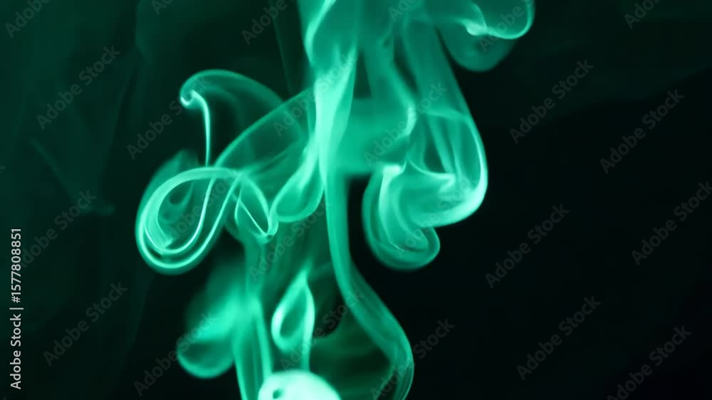 Aufkleber green ink swirling in dark fluid creating soft abstract shapes - artistic motion background for digi