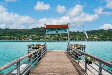 A view of the shoreline landscape of Maria Wörth on Lake Wöhrtersee