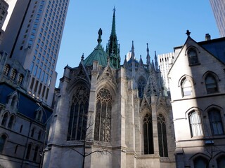 The apse and spires of St. Patrick’s Cathedral in New York, USA, highlighting neo-Gothic details,...