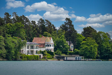 A view of the shoreline landscape of Maria Wörth on Lake Wöhrtersee