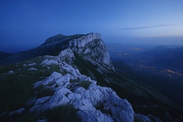 Fototapeta premium Dark blue starry night timelapse atop a majestic mountain overlooking the valley below, Time-lapse of dark blue starry night on the top of the mountain