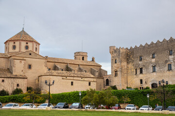 Fototapeta premium Historic view of Parròquia Sant Martí and Castell d'Altafulla in Tarragona, Catalonia. A charming hilltop village under golden sunlight.