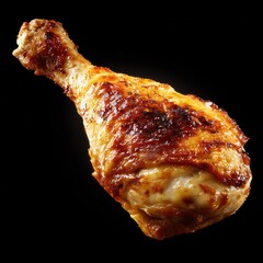 Juicy roasted chicken leg with crispy skin served on dark background