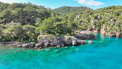 Naklejka premium defaultKorsan Cove. Located in the Kumluca district, Korsan Cove ( K is a small and clean bay containing the ruins of the Ancient City of Melanippe, to the west of Gelidonya Feneri. Korsan Koyu Karaoz