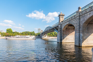 View of the Moscow river embankment, Pushkinsky bridge and cruise ships at sunset.