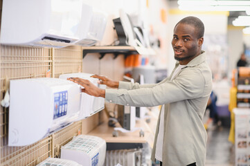 African american man shopping for home appliances