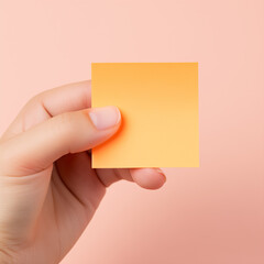 hand holding a blank note pad