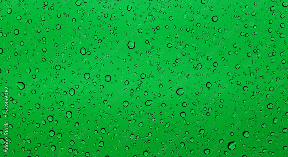 Aufkleber close up of water droplets on a green surface creating a textured and vibrant visual effect