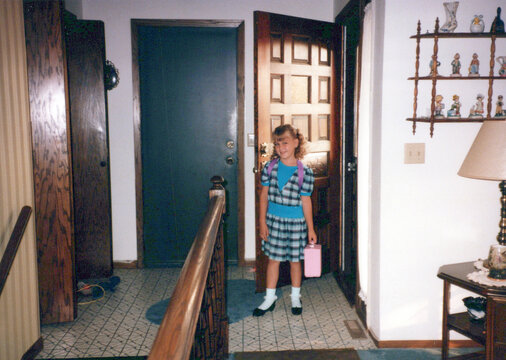 Circa 1986 - back to school first day portrait of a first grader student going to elementary school