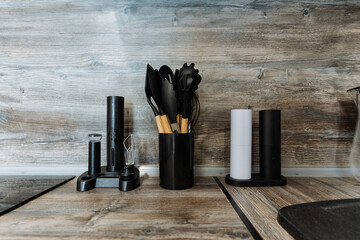 Explore our collection of modern kitchen utensils and accessories featuring a sleek black finish...
