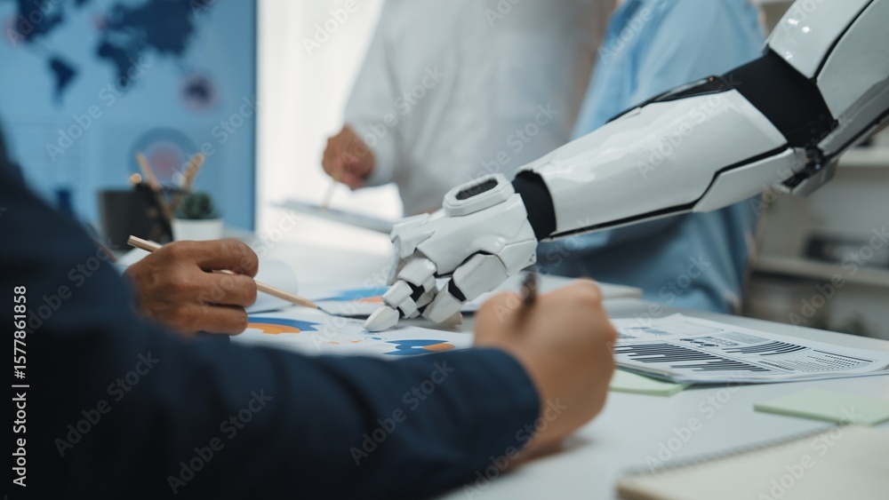Poster human and robot collaborate during a meeting, analyzing data charts on a table, showcasing the integ