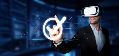 A professional man wearing a virtual reality headset interacts with a digital interface, symbolizing quality assurance and management in advanced technology solutions. XDMCP