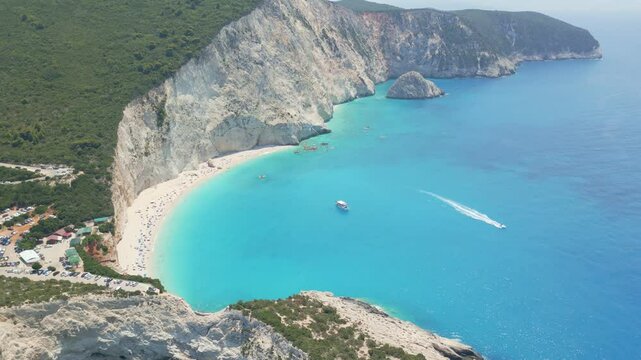 Spectacular aerial and ground views of Porto Katsiki beach on Lefkada island, Greece. Famous for its dramatic white cliffs and crystal-clear turquoise sea, this iconic Mediterranean spot 