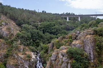 Fervenza do Toxa waterfall, one of Galicia’s best, framed by vivid green nature from a stunning...