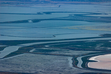 Aerial view of diverse wetlands and tidal channels in San Francisco Baylands