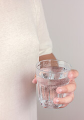 A glass of water in hand