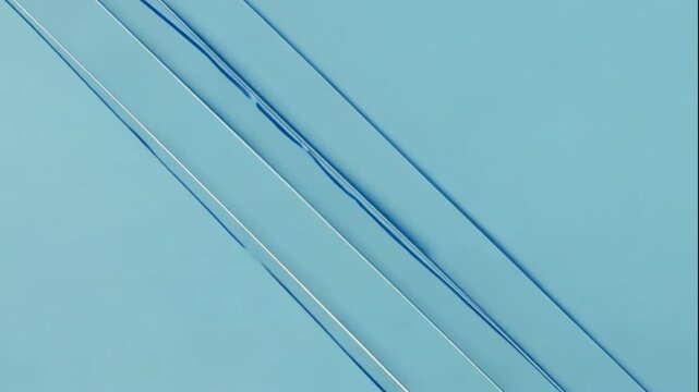 Three parallel thin lines diagonally crossing a solid pastel blue background, ultra-clean and modern

