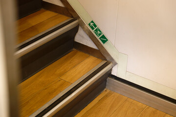 The ferry Norderaue has symbols for marking escape routes are glued on luminous strips on the stairs