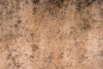 Beige wall shows vintage texture with dark spots and subtle earthy tones, adding rustic character to backgrounds and designs.