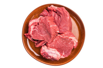 Raw Beef meat medallions on a decorative plate, fresh steaks ready for cooking. isolated on white...