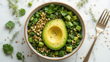 A bowl of salad with avocado, broccoli, sprouts and a fork on table