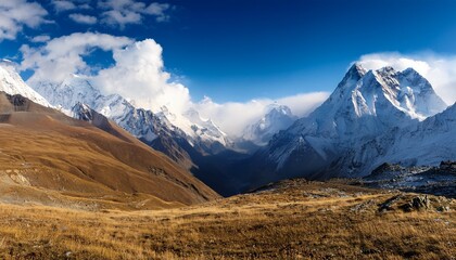 Fototapeta premium majestic mountain landscape under clear blue sky with clouds