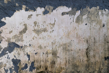 Distressed surface shows peeling paint on an aged stone background with textures and patterns that...