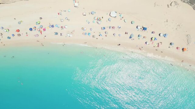 Spectacular aerial and ground views of Porto Katsiki beach on Lefkada island, Greece. Famous for its dramatic white cliffs and crystal-clear turquoise sea, this iconic Mediterranean spot 