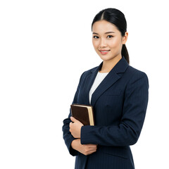 Portrait of a smiling asian woman in a business suit holding a book against a black background