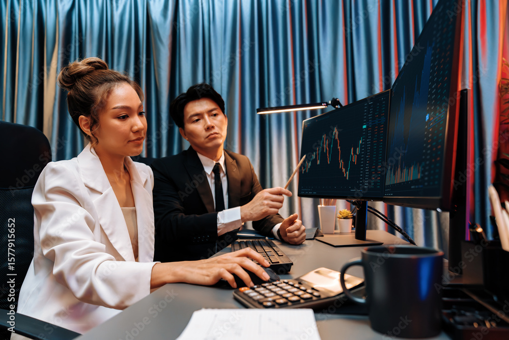 Poster smiling asian business traders pointing to dynamic stock exchange data screen profit value online we