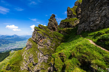 Summer mountain hiking in Tyrol (Austria) - path along the rock in the ascent to the Kitzbüheler...