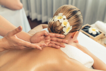 Caucasian couple customer enjoying relaxing anti-stress spa massage and pampering with beauty skin...