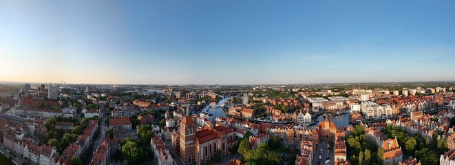 Aerial photo taken by drone over the historic tourist center of Gdansk, the city hall and the cathedral on a summer day, Poland, Europe