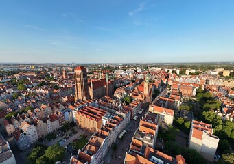 Aerial photo taken by drone over the historic tourist center of Gdansk, the city hall and the cathedral on a summer day, Poland, Europe