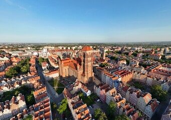 Aerial photo taken by drone over the historic tourist center of Gdansk, the city hall and the cathedral on a summer day, Poland, Europe