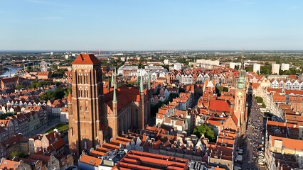 Aerial photo taken by drone over the historic tourist center of Gdansk, the city hall and the cathedral on a summer day, Poland, Europe