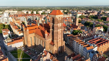 Aerial photo taken by drone over the historic tourist center of Gdansk, the city hall and the cathedral on a summer day, Poland, Europe