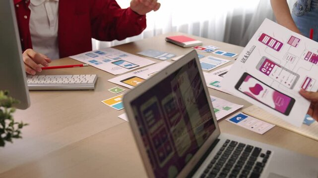 Panorama video of startup company employee planning on user interface prototype for mobile application or website in office. UX UI designer brainstorm designing user friendly interface plan. Synergic