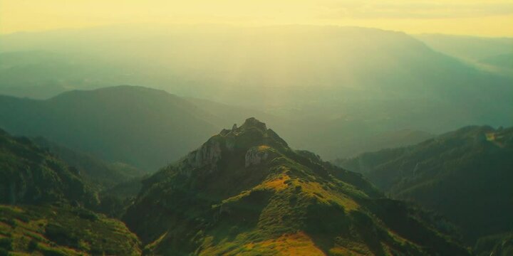 Aerial cinematic view of rocky mountain peaks near Tiganesti refuge in Bucegi Mountains at sunset