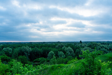 A cloudy dawn gently unfolds over a picturesque village in the Poltava region of Ukraine, casting a...
