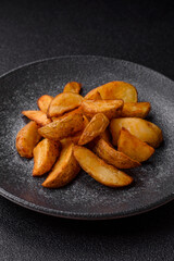 Grilled potato wedges with rosemary, cheese, salt and spices. Baked potato slices