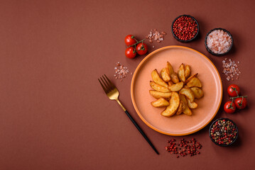 Grilled potato wedges with rosemary, cheese, salt and spices. Baked potato slices