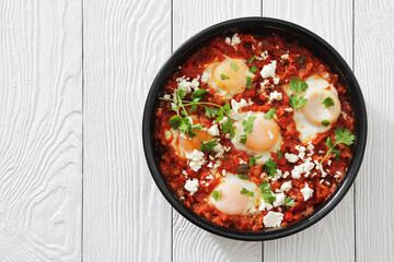 shakshuka, eggs poached in tomato vegetable sauce