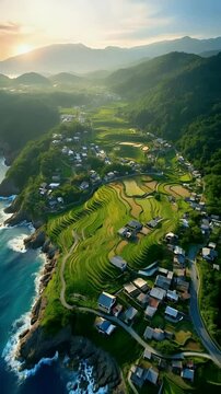 Terraced Rice Fields and Coastal Village at Sunrise in Mountain Landscape