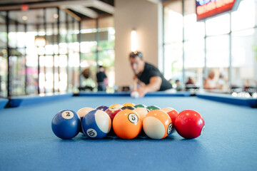 Man Hitting a Cue Ball Playing Pool