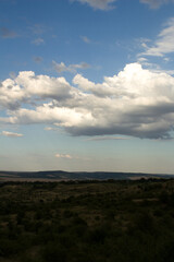 A landscape with clouds and blue sky