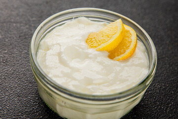 Lemon yogurt natural product skyr sour milk skir fresh delicious gourmet food background on the...